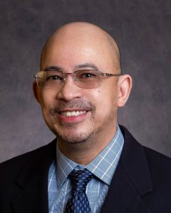 Headshot of a male person.